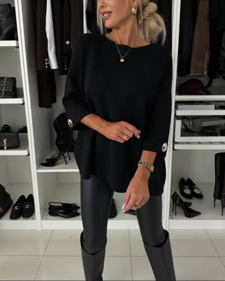 CLAIRE – ELEGANTE RELAXTE TRUI MET KNOOPMANCHETTEN