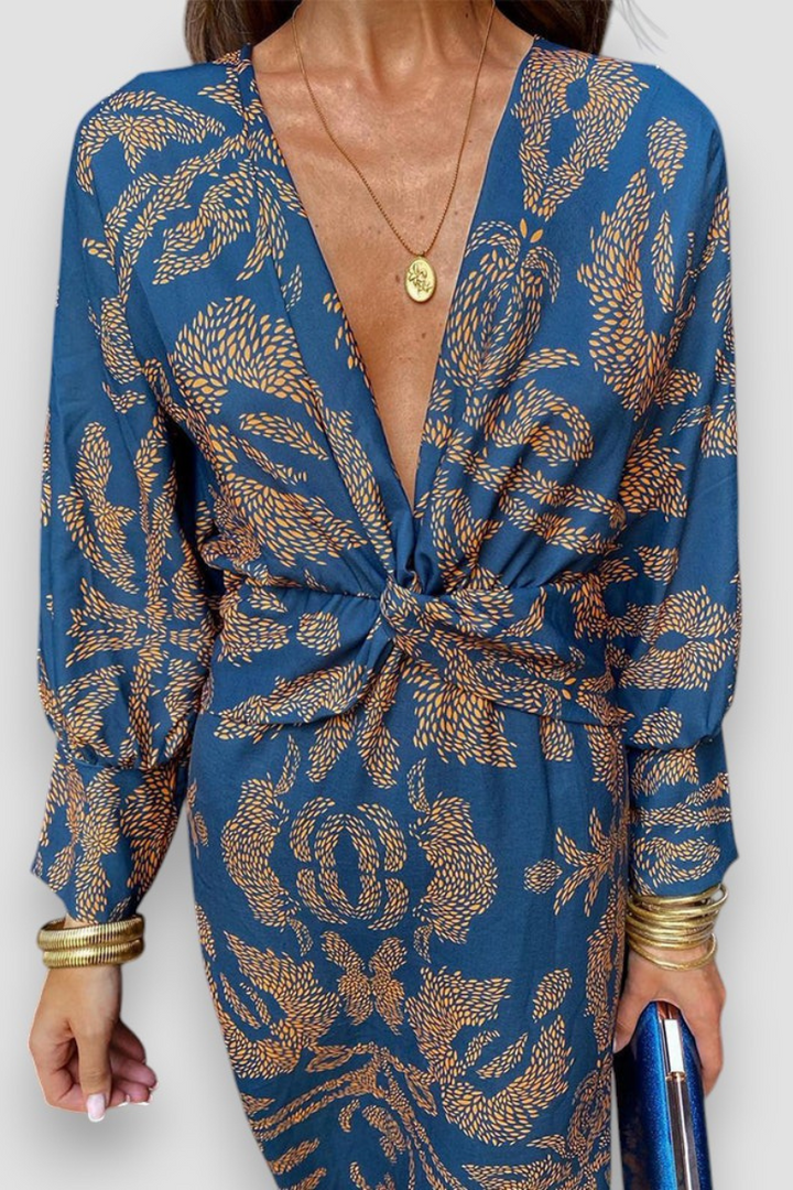 Elegante midi-jurk met twist-detail en bloemenpatroon – Tijdloos en stijlvol