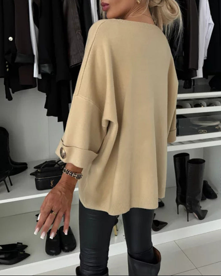 CLAIRE – ELEGANTE RELAXTE TRUI MET KNOOPMANCHETTEN