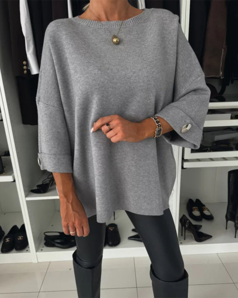 CLAIRE – ELEGANTE RELAXTE TRUI MET KNOOPMANCHETTEN