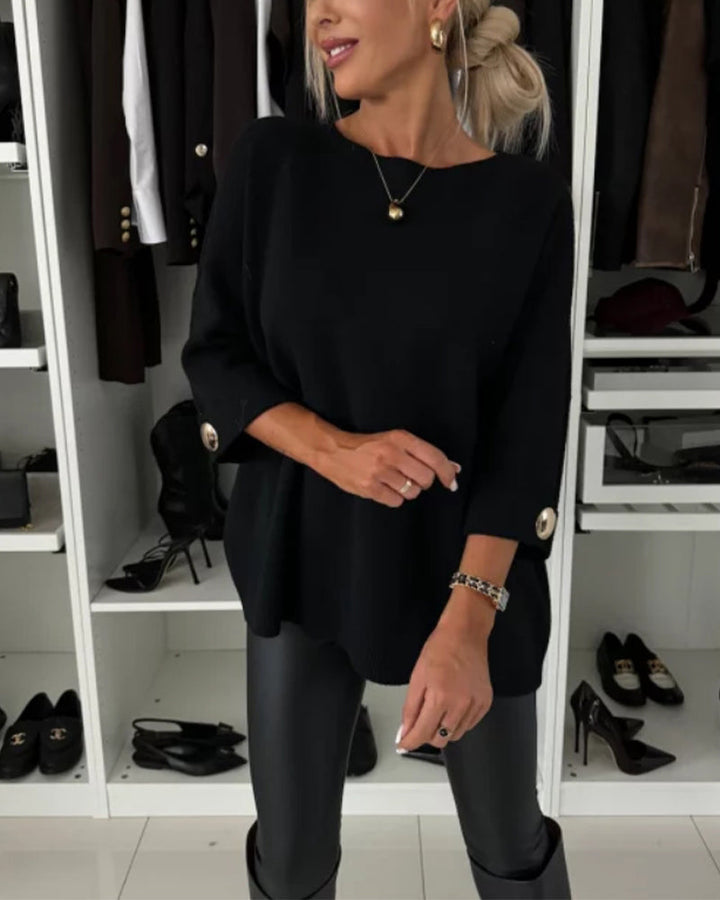CLAIRE – ELEGANTE RELAXTE TRUI MET KNOOPMANCHETTEN