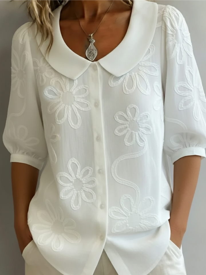 Elegante blouse met korte mouwen en bloemen decor