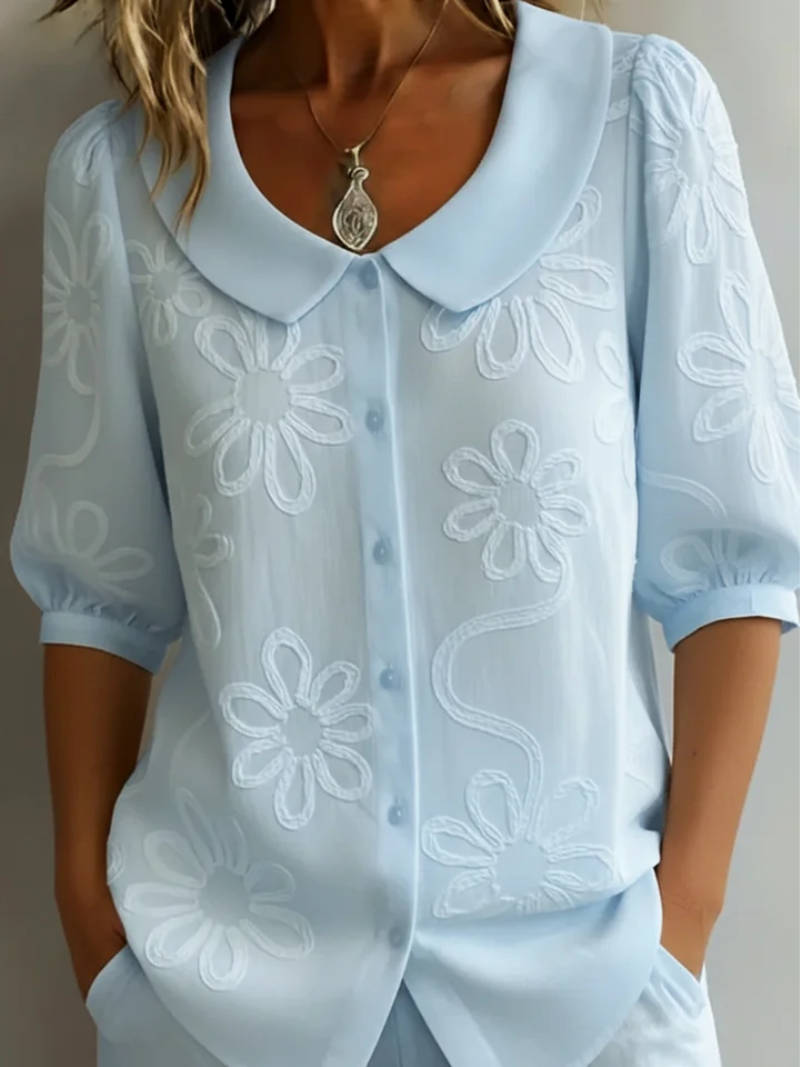 Elegante blouse met korte mouwen en bloemen decor